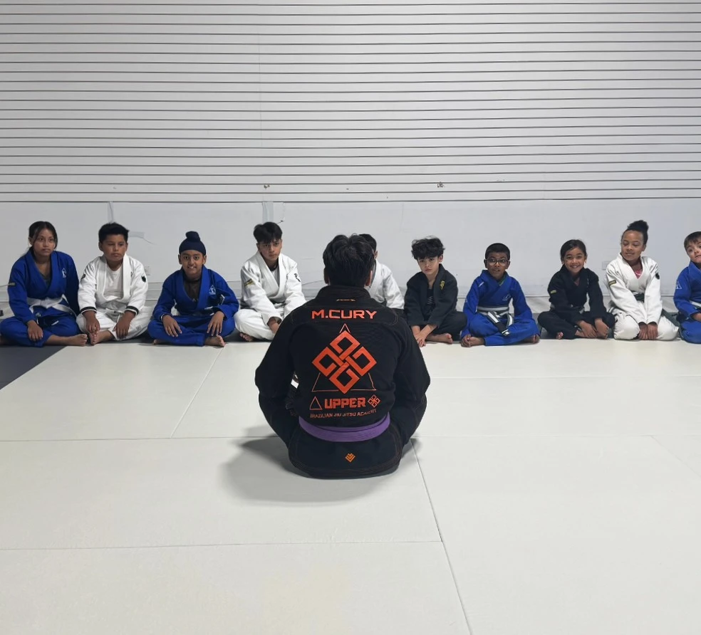 Coach teaching Brazilian Jiu-Jitsu class