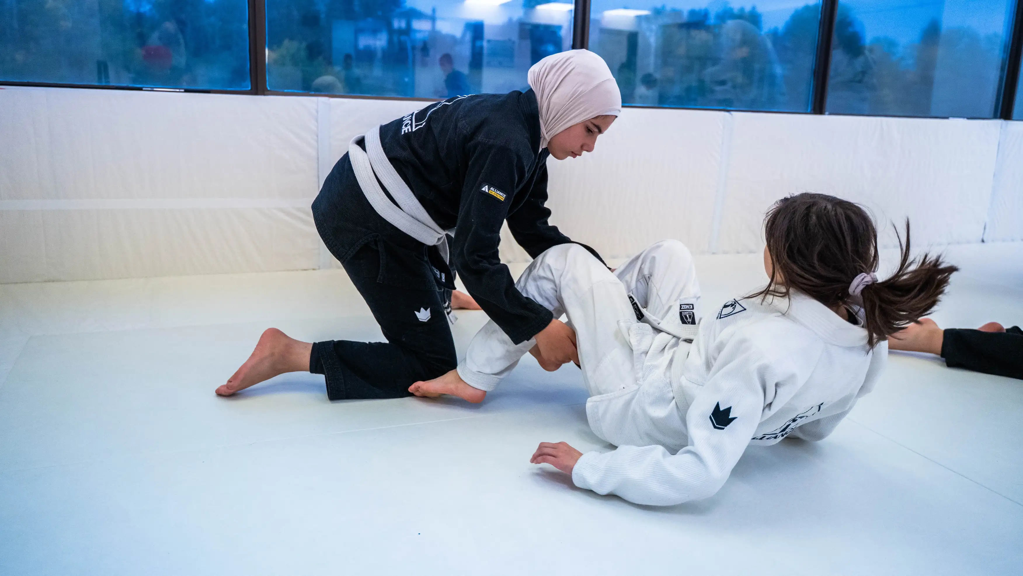 Brazilian Jiu-Jitsu students training at Upper Jiu-Jitsu Academy